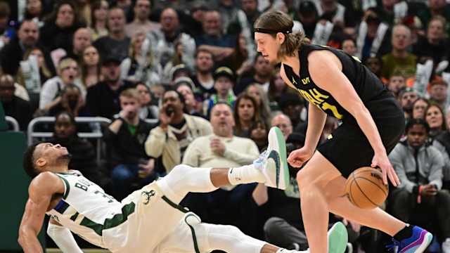 Utah Jazz forward Kelly Olynyk (41) and Milwaukee Bucks forward Giannis Antetokounmpo (34) 